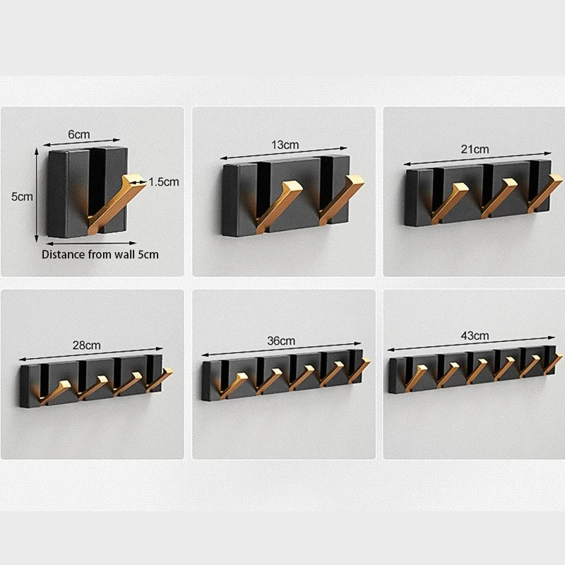Stylish wall hook in black & gold, modern foldable design for efficient storage in any room.