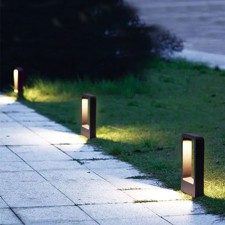 Modern black LED outdoor garden light, sleek design for pathways and landscaping.