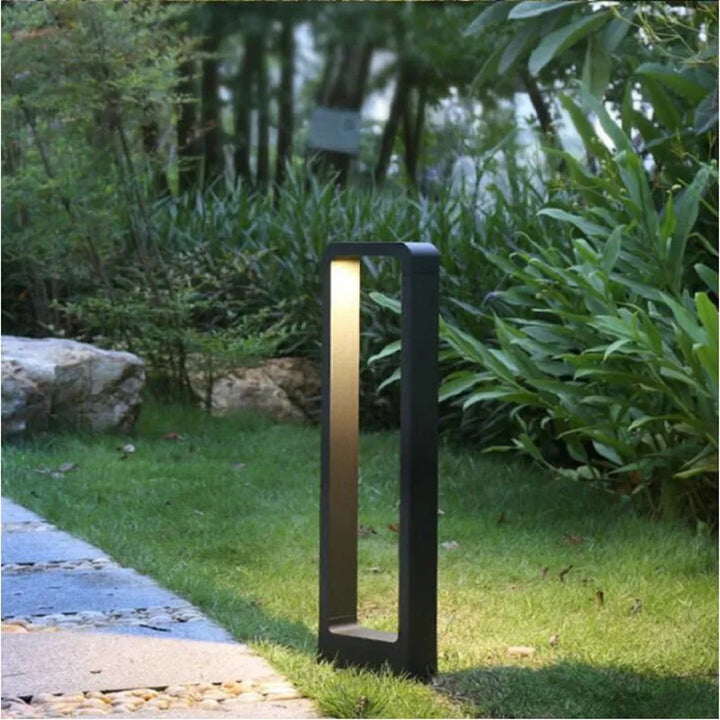Durable gray IP68 weatherproof bollard light for modern garden and lawn pathways.