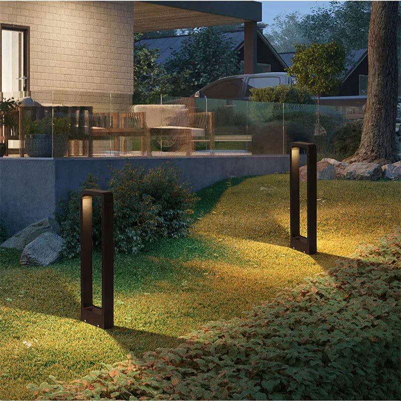 Sleek gray outdoor LED pathway light, weatherproof and durable for contemporary gardens.