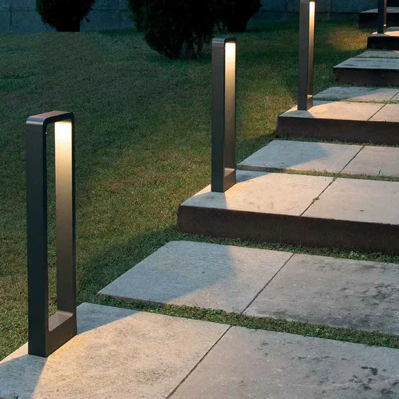 Contemporary gray LED landscape light, energy-efficient and weatherproof for pathways.