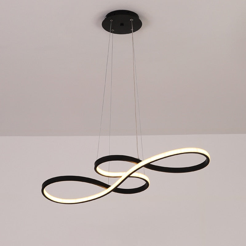 Designer gold linear pendant, ideal adjustable lighting for a sophisticated living room ambiance.