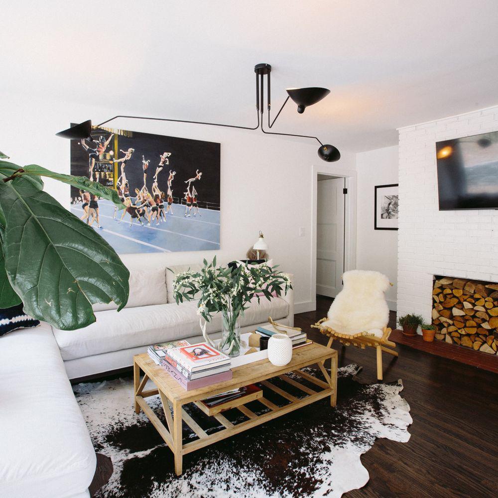 Adjustable white multi-arm light fixture, contemporary design style.