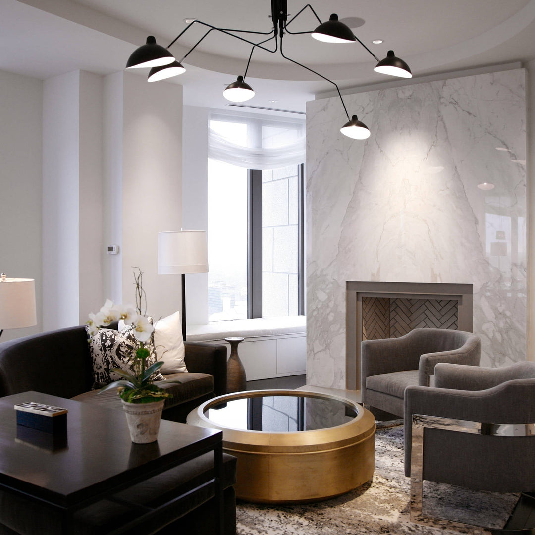 White multi-arm ceiling light, adjustable, creating dynamic home ambiance.