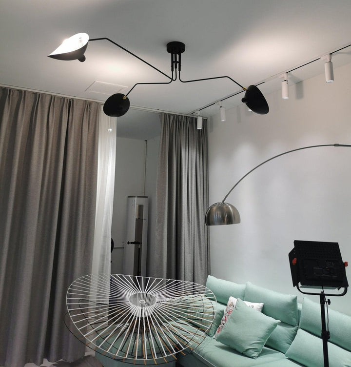 Contemporary adjustable multi-arm ceiling lamp, white, sleek design.