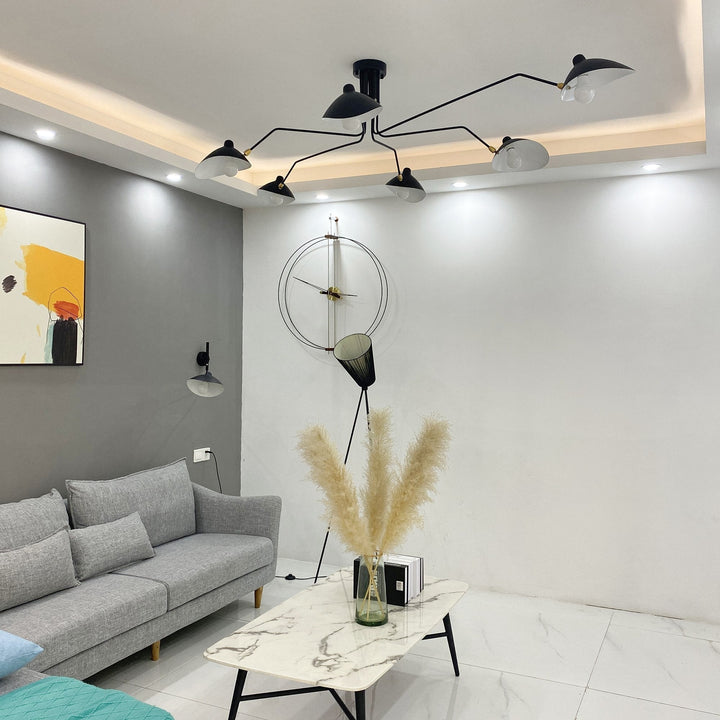 Minimalist black multi-arm lamp, adjustable, great for living room.
