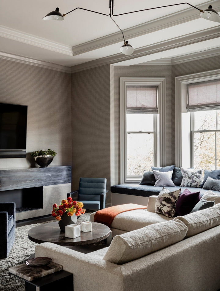 Modern adjustable white multi-arm ceiling light for the dining area.