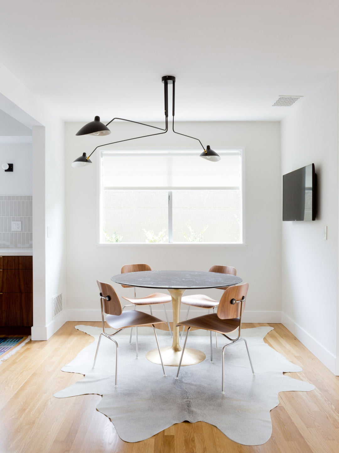 Dynamic black multi-arm ceiling light, adjustable for perfect illumination.