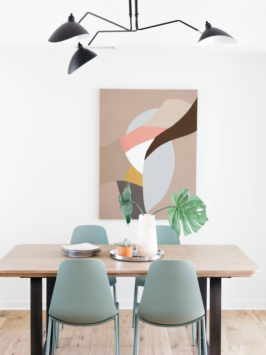 White multi-arm ceiling lamp, adjustable, providing adaptable light.