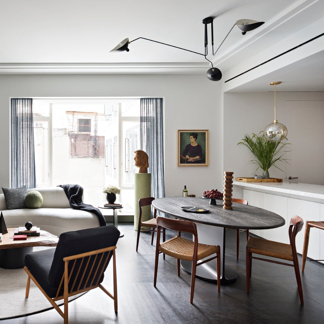 Adjustable black multi-arm light fixture, modern design, ideal for homes.