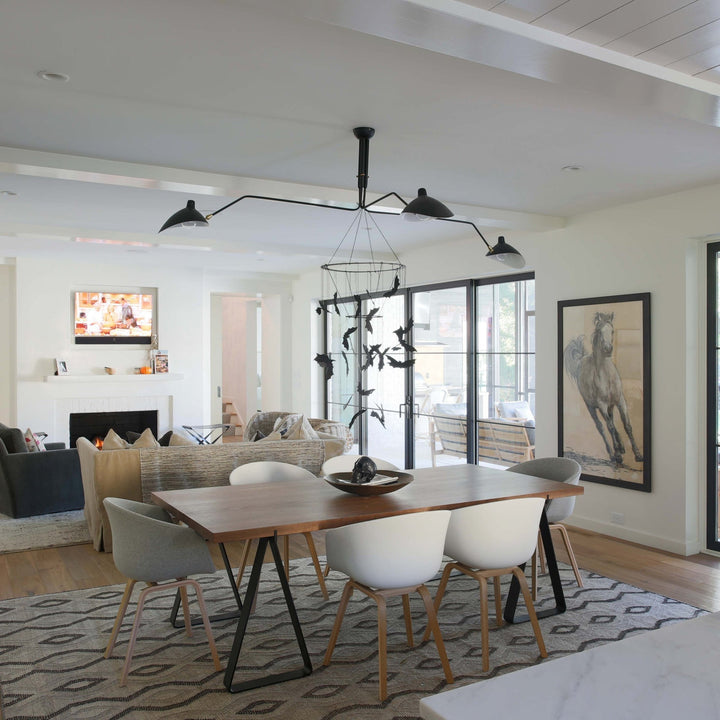 White adjustable multi-arm ceiling light, a minimalist and bright solution.