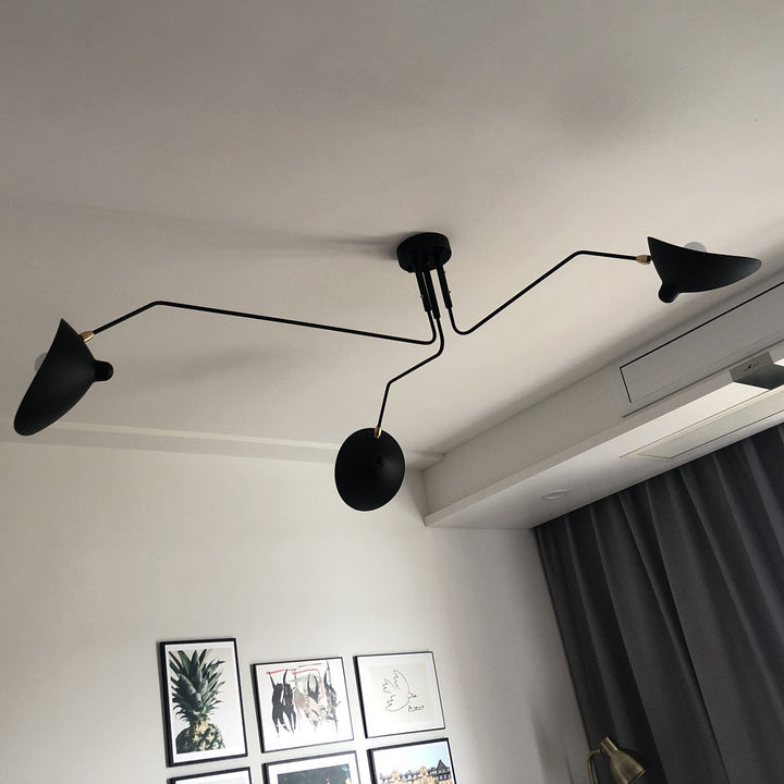 Modern black multi-arm adjustable light for contemporary home decor.