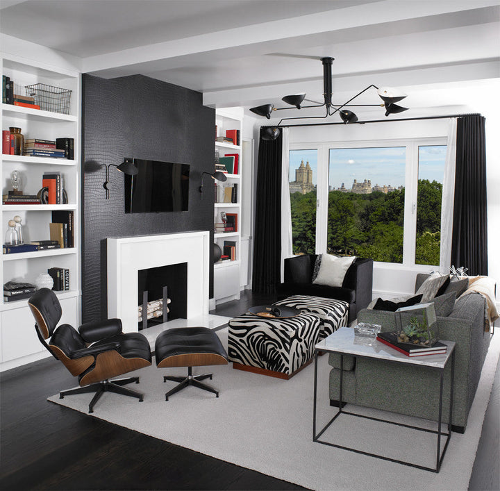 Black multi-arm ceiling light, adjustable, for a sleek modern look.