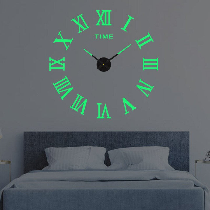 Unisex modern black quartz wall clock for any room's decor.