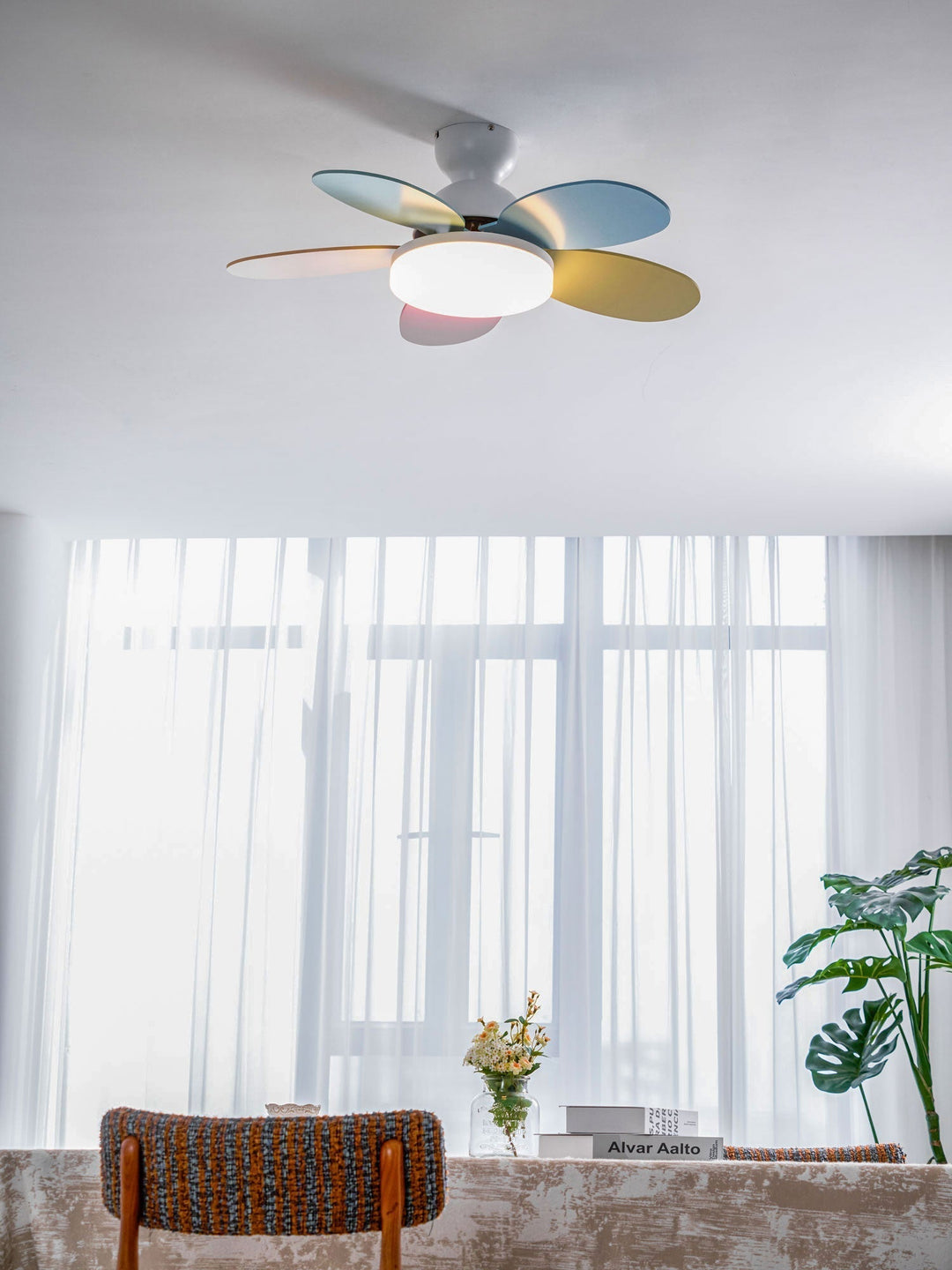 Modern ceiling fan with warm LED light, wooden blades, and quiet airflow.