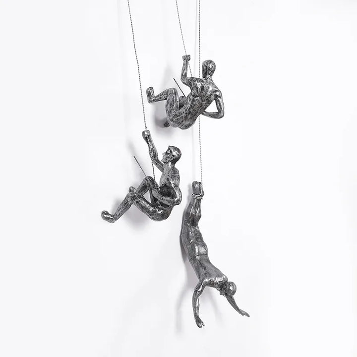 Modern climbing figures wall sculpture set for contemporary home decor.