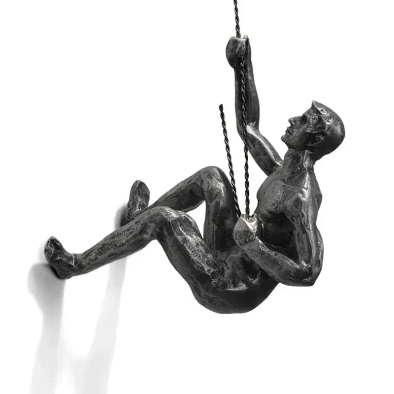 Modern wall decoration with climbing figures, artistic accent for home.