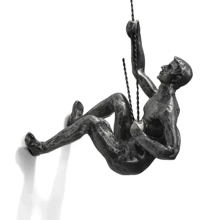 Modern wall decoration with climbing figures, artistic accent for home.