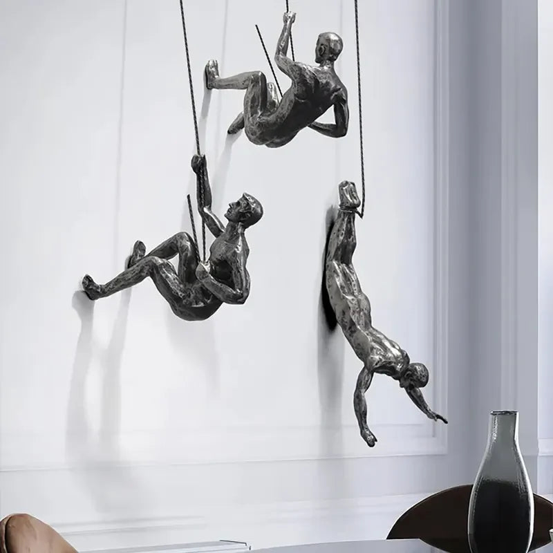 Artistic climbing men wall decor, perfect for modern living room accents.