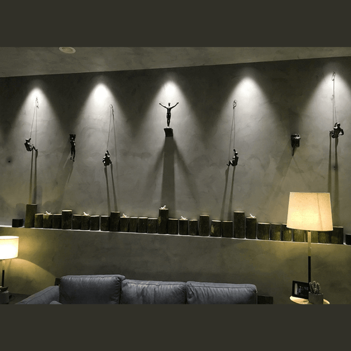 Contemporary wall art: climbing men figures, ideal for office or living spaces.