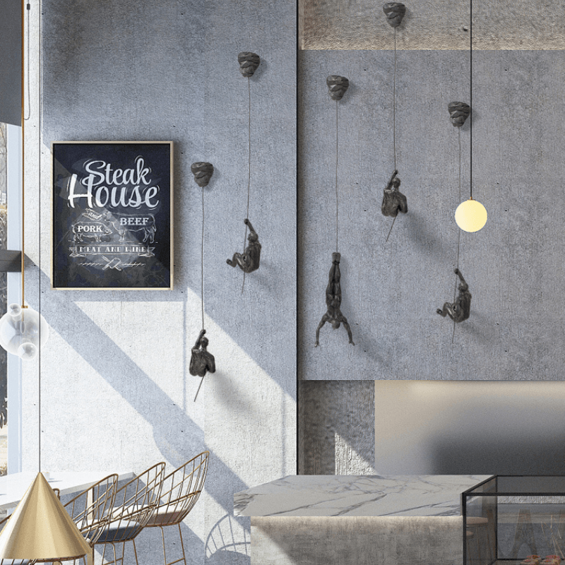 Modern wall sculpture set of climbing men, perfect for living room accent.