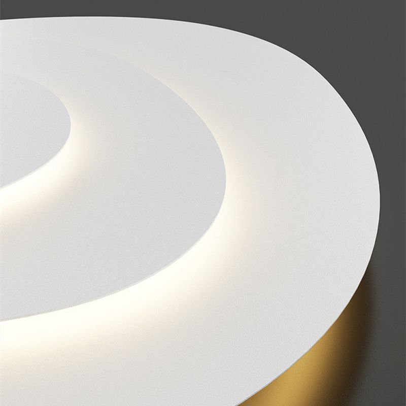 Soft white light from cloud-shaped LED flush mount ceiling fixture, creates cozy ambiance.