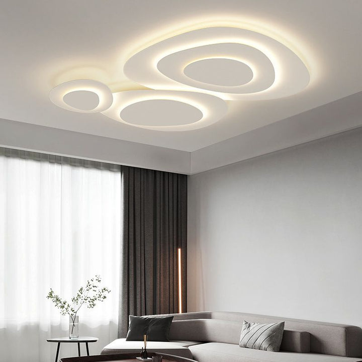 Contemporary cloud LED flush mount light, enhances bedroom or hallway modern home lighting.