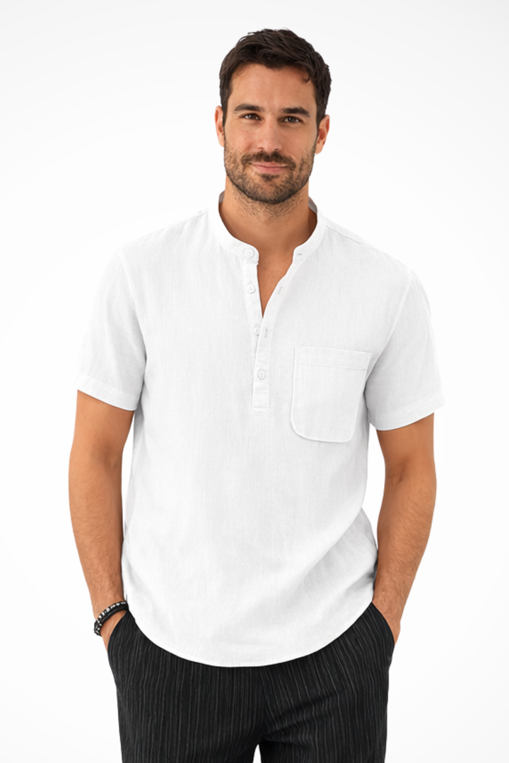 Detail: Patch pocket on a modern collarless men's short sleeve casual shirt, key summer fashion.