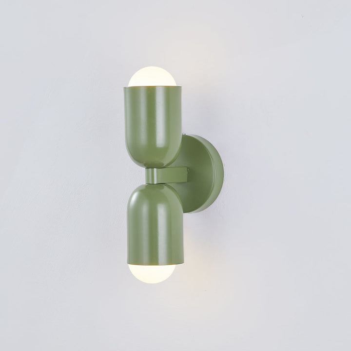 Modern accent LED wall lamp, sleek metal cylinder design for stylish homes.
