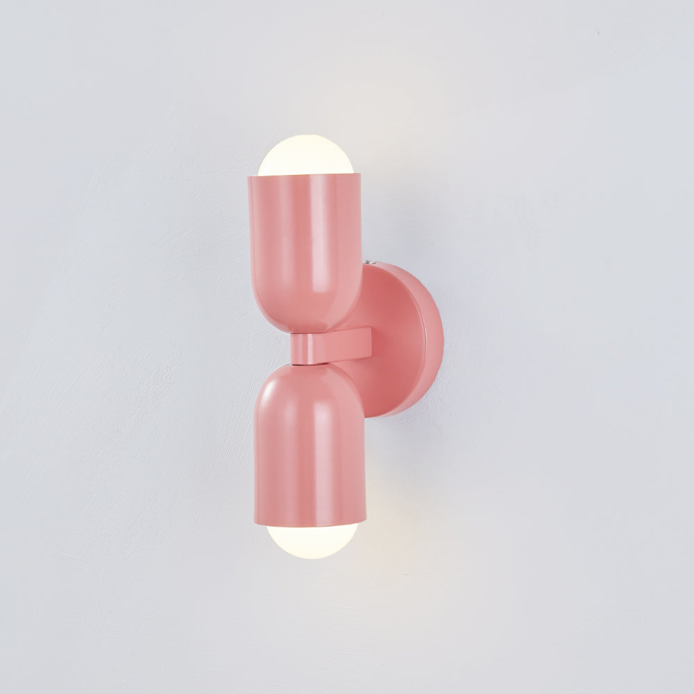 Bedroom Cylinder LED wall light, energy-efficient and modern for cozy spaces.