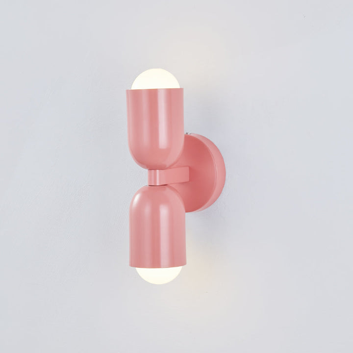 Bedroom Cylinder LED wall light, energy-efficient and modern for cozy spaces.