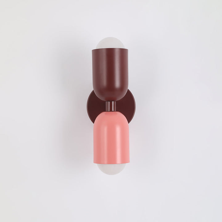 Modern accent LED wall lamp, cylindrical for a chic and contemporary space.