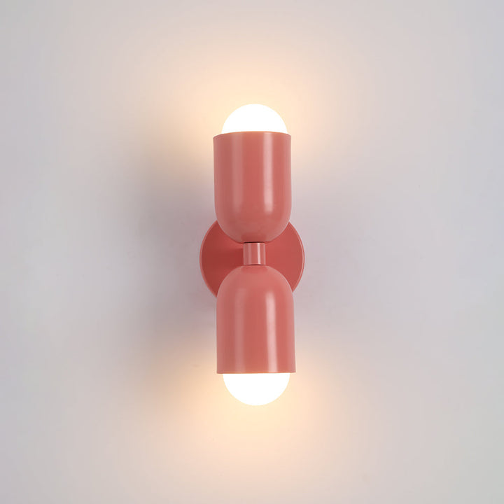 Stylish metal cylinder indoor wall lamp with integrated LED for modern decor.