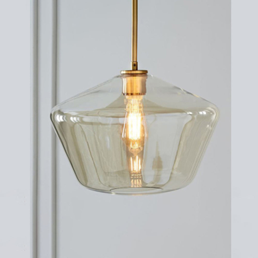 Sleek diamond pendant light with clear glass shade for a modern dining space.