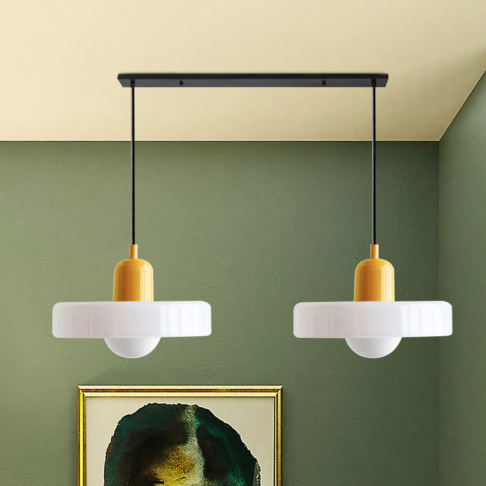 Sophisticated double glass pendant, enhancing the dining room atmosphere.