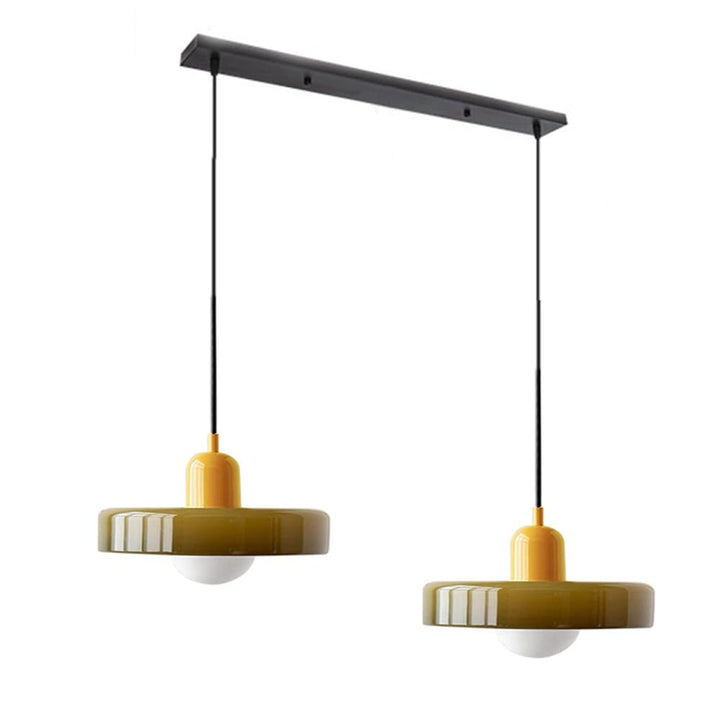 Sleek double glass hanging light, complementing modern dining room designs.
