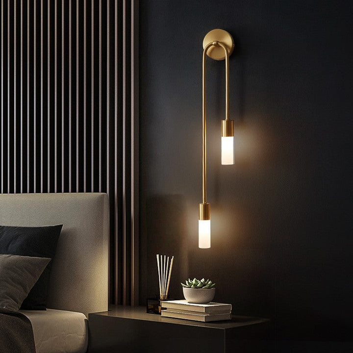 Elegant Eldmo modern LED wall light, gold finish, ideal for stylish bedroom accent lighting and decor.