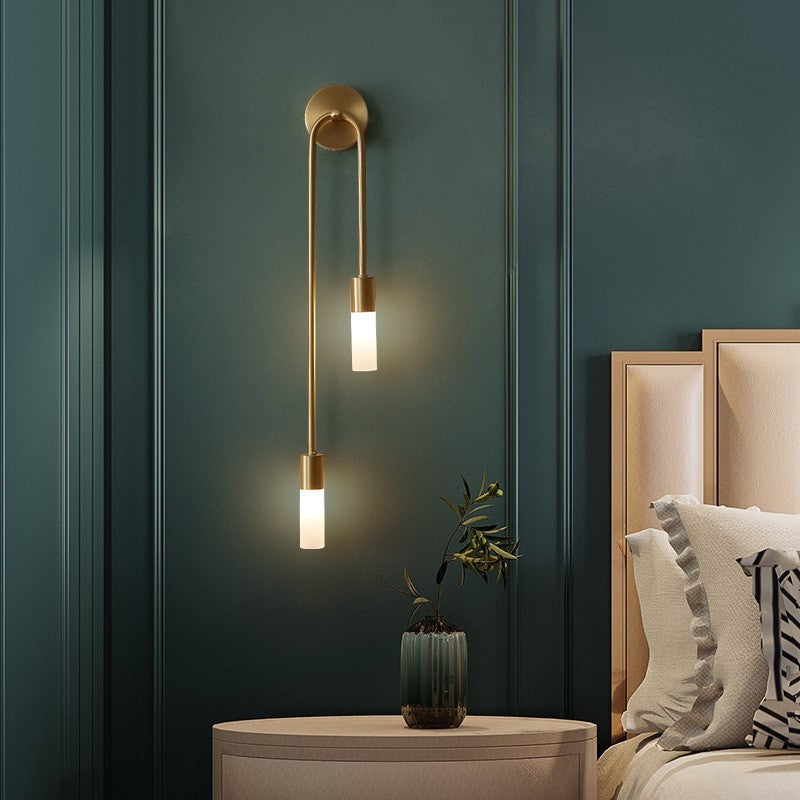 Contemporary Eldmo wall lamp, stunning gold finish, two-light LED fixture for modern home decor.