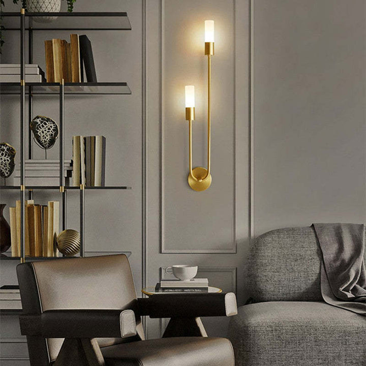 Eldmo modern two-light LED wall fixture, elegant gold finish, enhances contemporary indoor spaces.