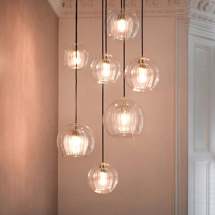 Elegant modern globe pendant light, perfect for stylish dining rooms and bedrooms.