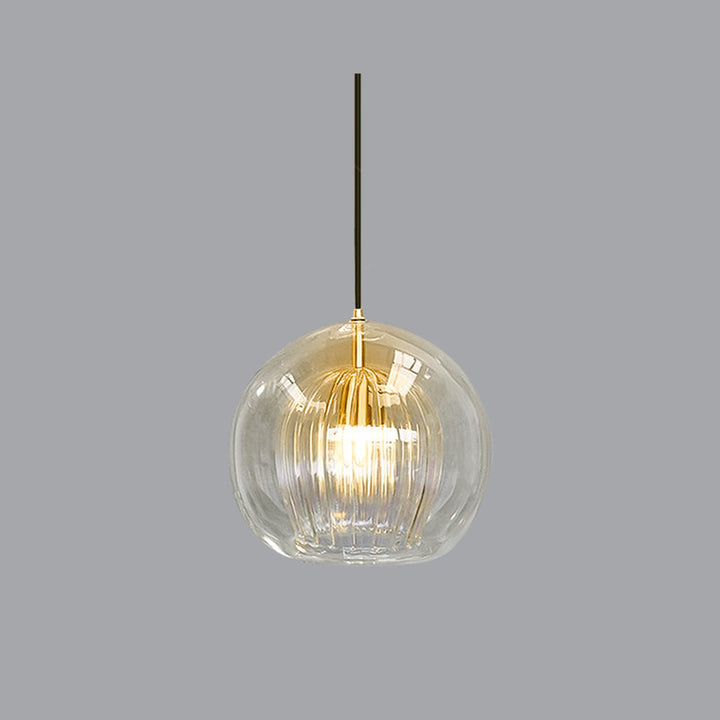 Chic glass globe pendant light adds modern elegance to any room decor.