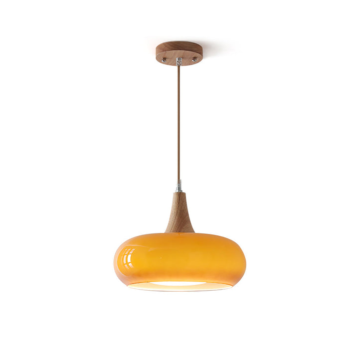 Modern glass pendant light with wood accents for stylish dining rooms.