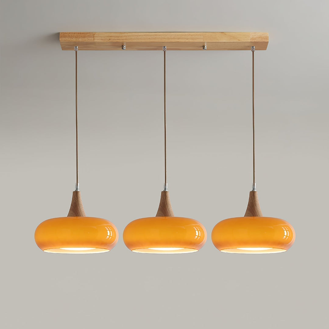 Artistic modern glass pendant light with wood finish, great for modern home decor.