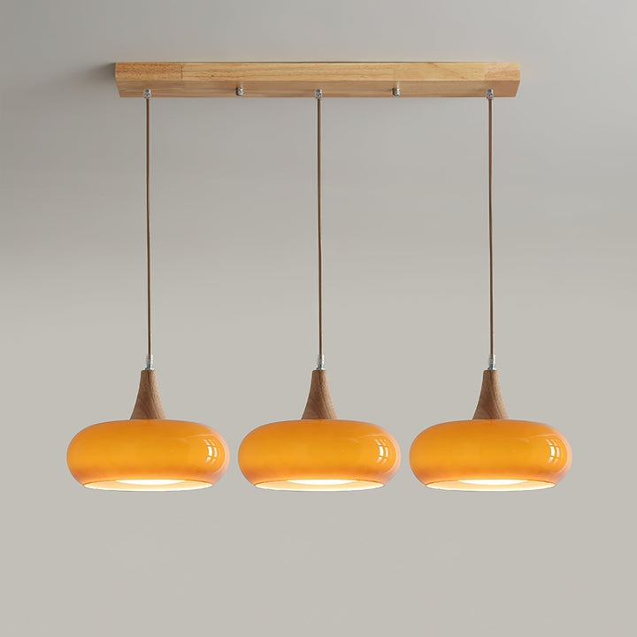 Artistic modern glass pendant light with wood finish, great for modern home decor.