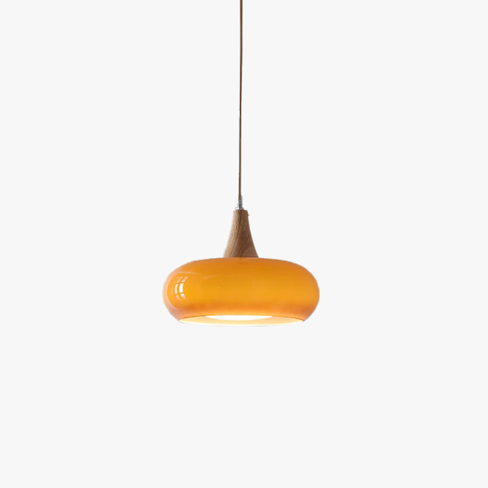 Modern style glass pendant light with wood, perfect ceiling fixture for any dining room.