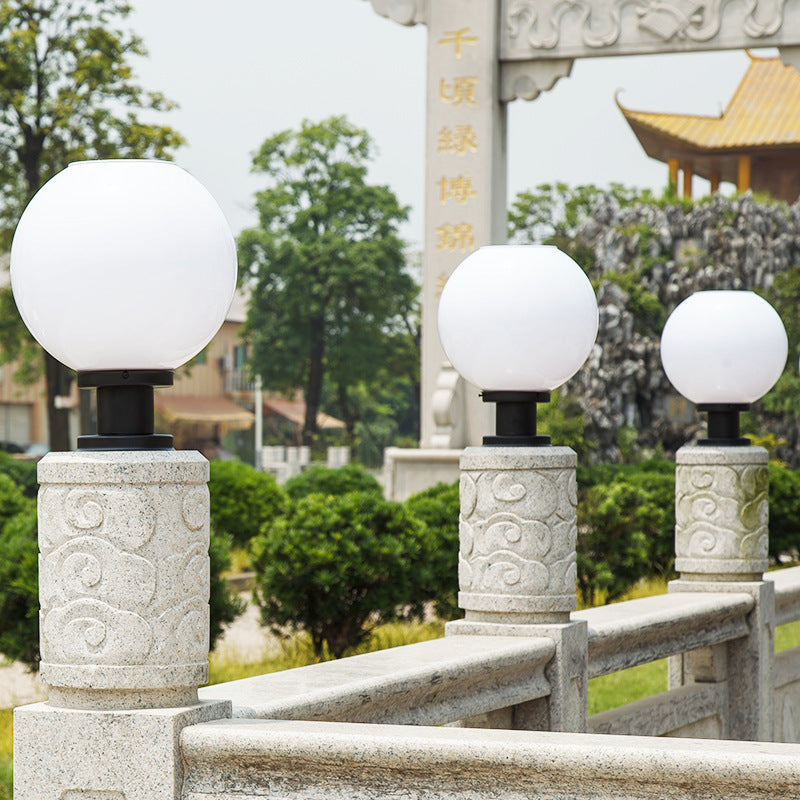 Sleek stainless steel globe post lights for outdoor garden and pathway lighting. Modern landscape decor, LED compatible.