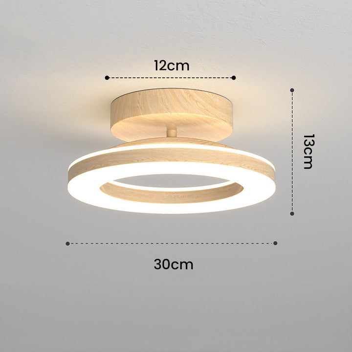 Modern Glow Disc LED lamp, providing uniform, soft light for a stylish bedroom.