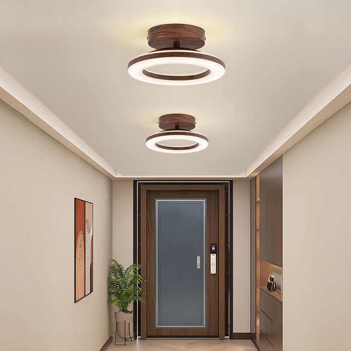 Modern LED ceiling fixture with a sleek disc profile, ideal for low-profile illumination.