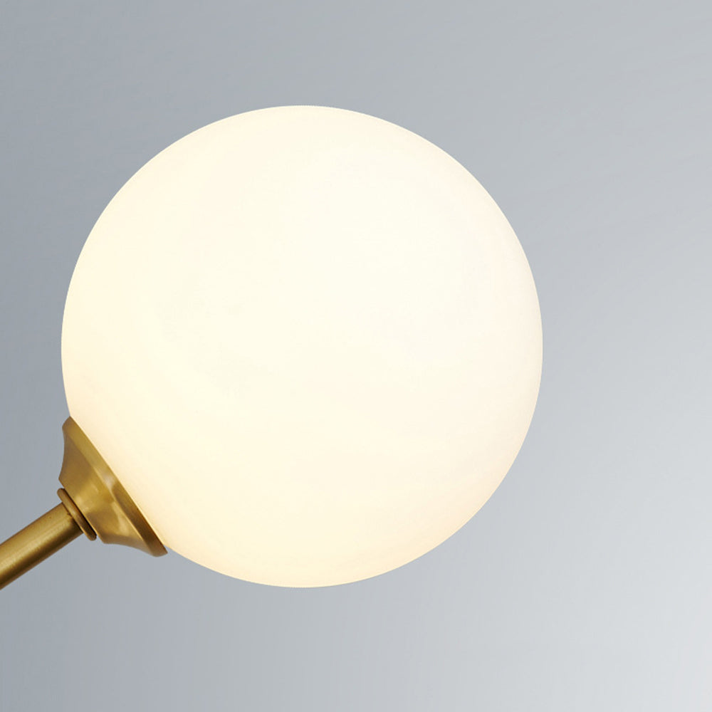 Modern multi-light globe chandelier, sleek gold finish perfect for high ceilings.