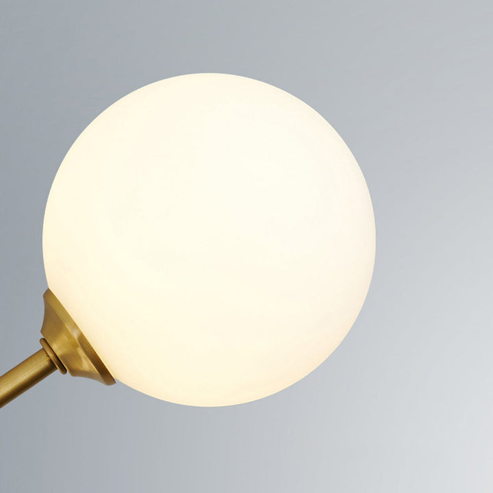 Modern multi-light globe chandelier, sleek gold finish perfect for high ceilings.